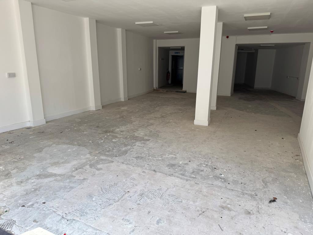Lot: 46 - TOWN CENTRE LOCK-UP SHOP FOR INVESTMENT OR OWNER OCCUPATION - Looking Inside the Shop from The High Street
